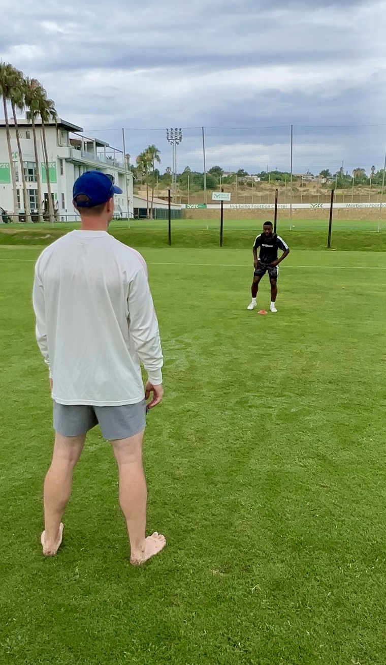 Eric Franke coaching an athlete during a session